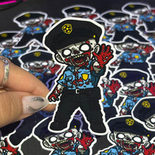 Cargar imagen en el visor de la galería, Sticker Policia Zombie| Resident Evil |
